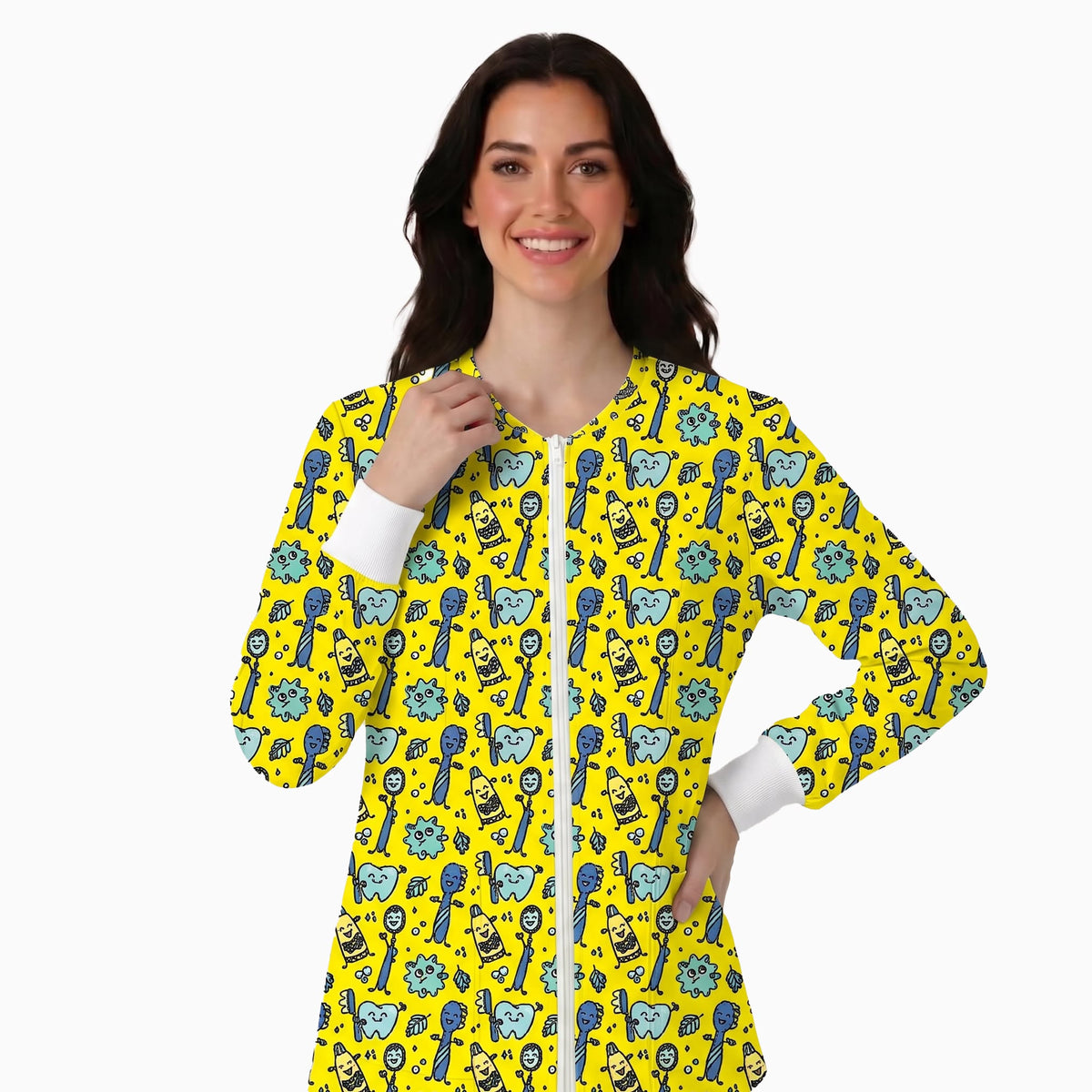 A woman modeling a long-sleeve zip-front tunic top with a bright yellow background and an all-over repeating pattern of blue and black cartoon-style keys and lock icons, against a plain light gray studio background.