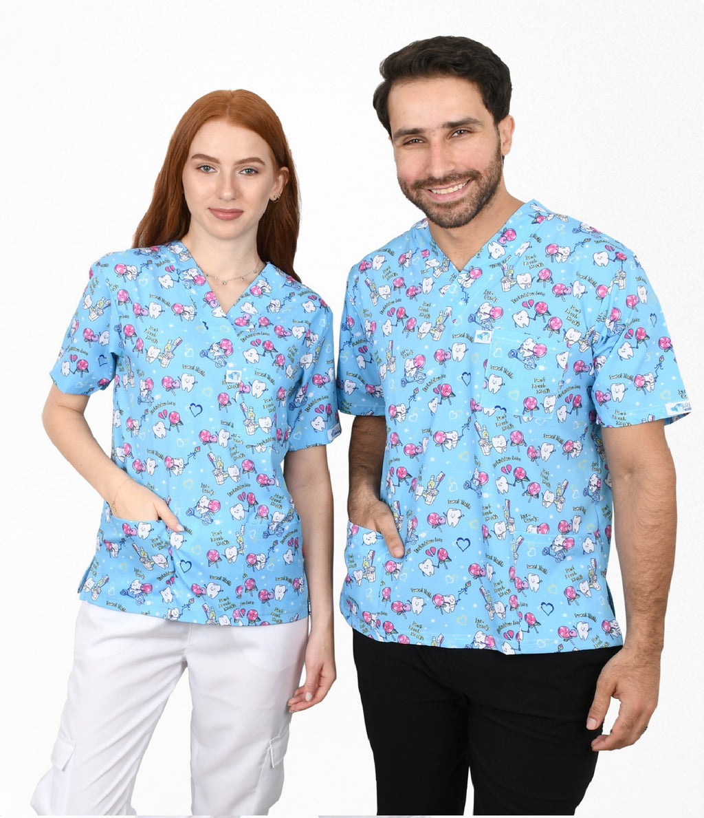 Female and male healthcare professionals wearing blue pediatric dental printed scrub top with tooth and dental tool pattern.