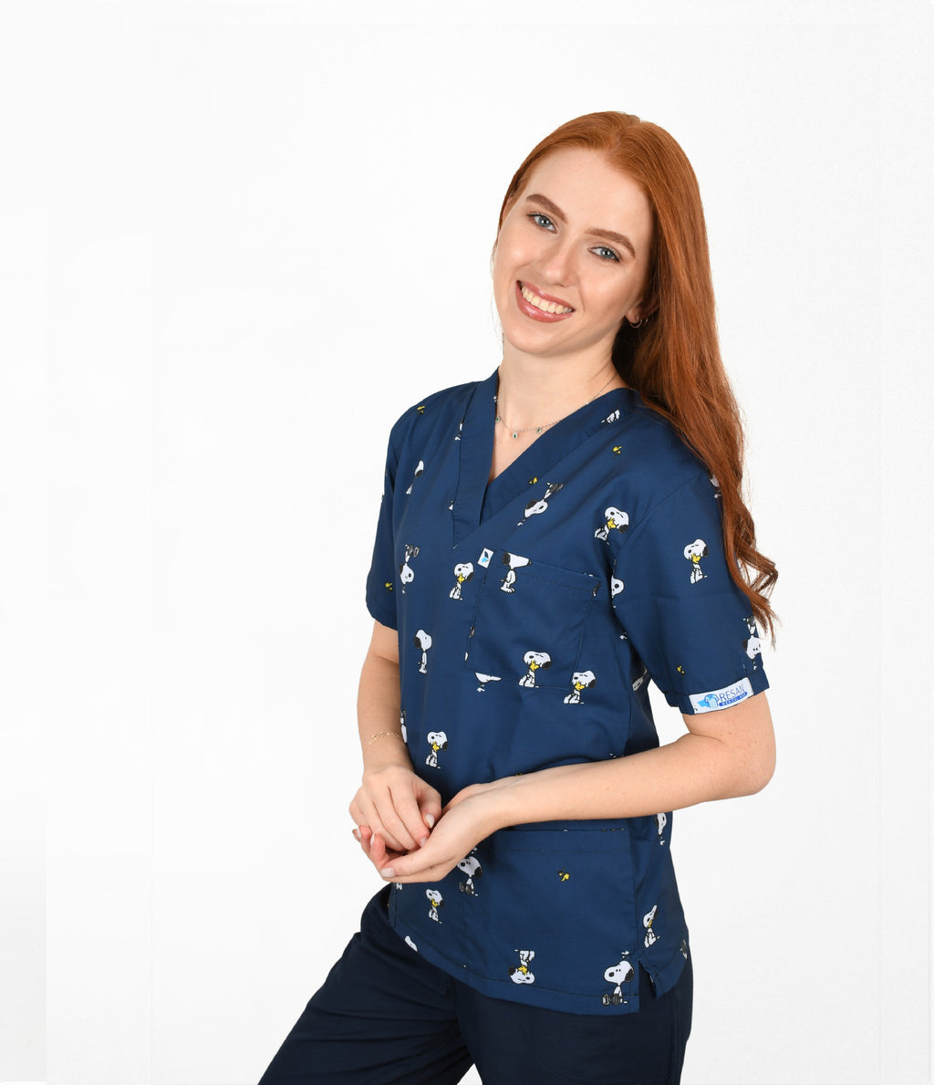Female healthcare worker wearing navy cartoon snoopy printed medical scrub top with front pockets. need 3 other alt text