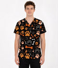 Male model wearing Paws & Bones pet lover scrub top with orange paw prints and bone pattern.