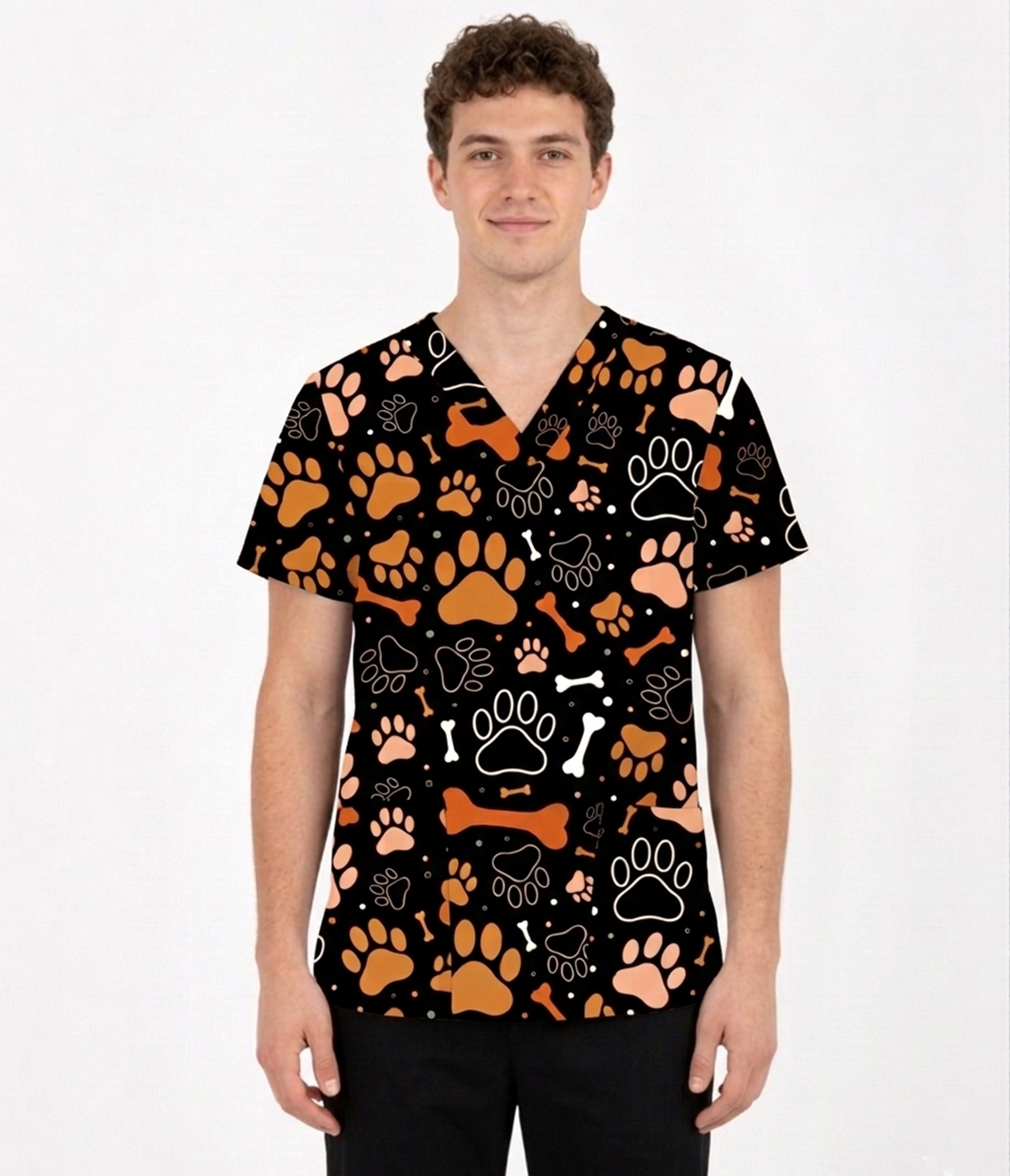 Male model wearing Paws & Bones pet lover scrub top with orange paw prints and bone pattern.